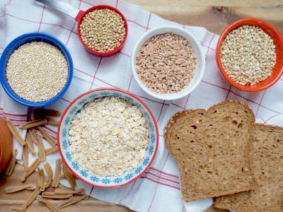 Assorted Grains in bowls and slices of bread