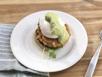Eggs Benedict with salmon patty and avocado sauce