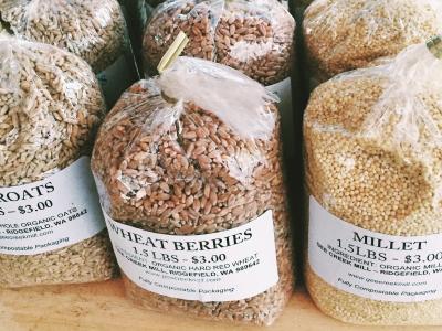photo of bags of wheat berries at a farmers market
