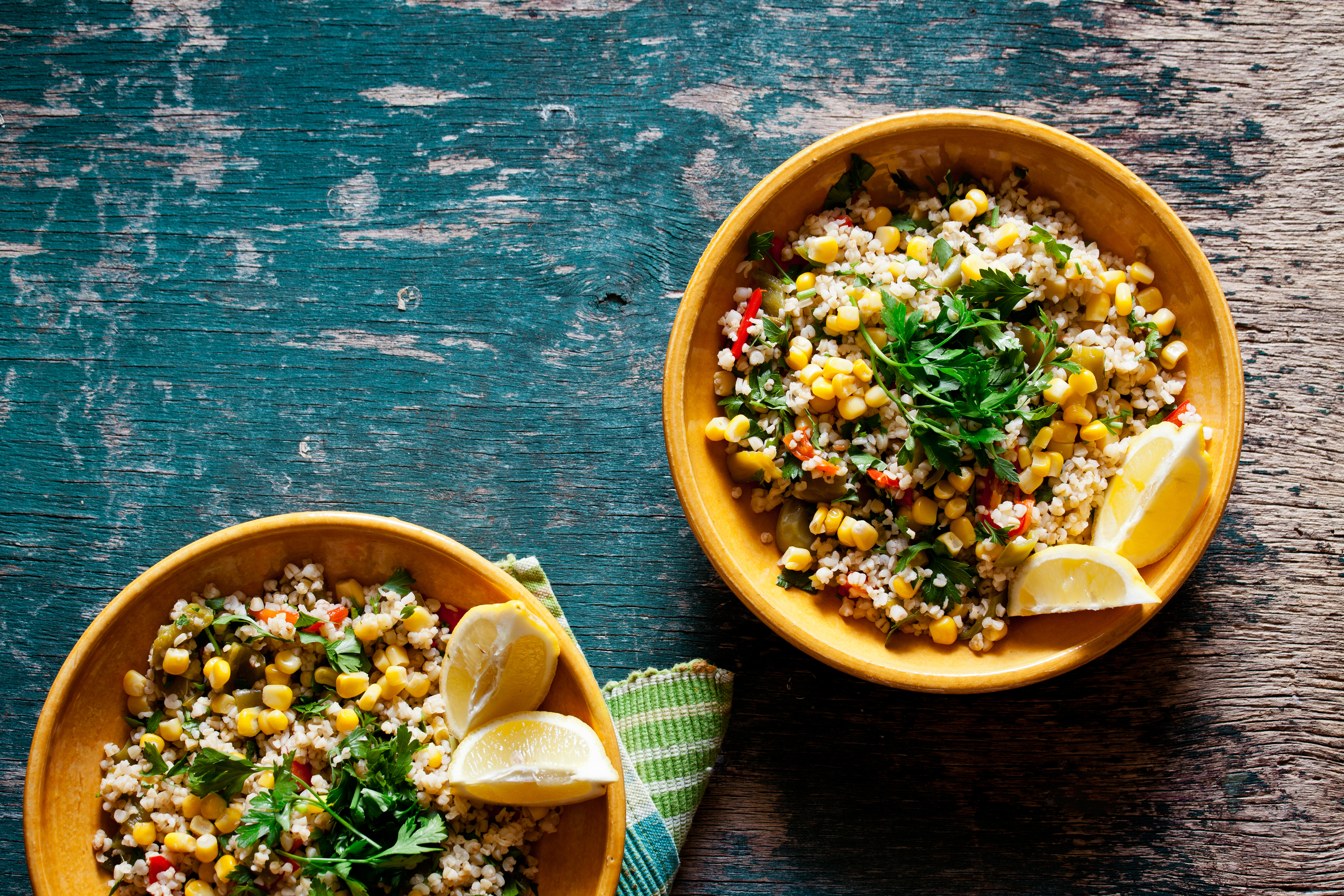 Grain bowls with wedges of lemon