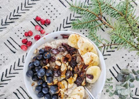 a bowl of fonio hot cereal with dried fruit