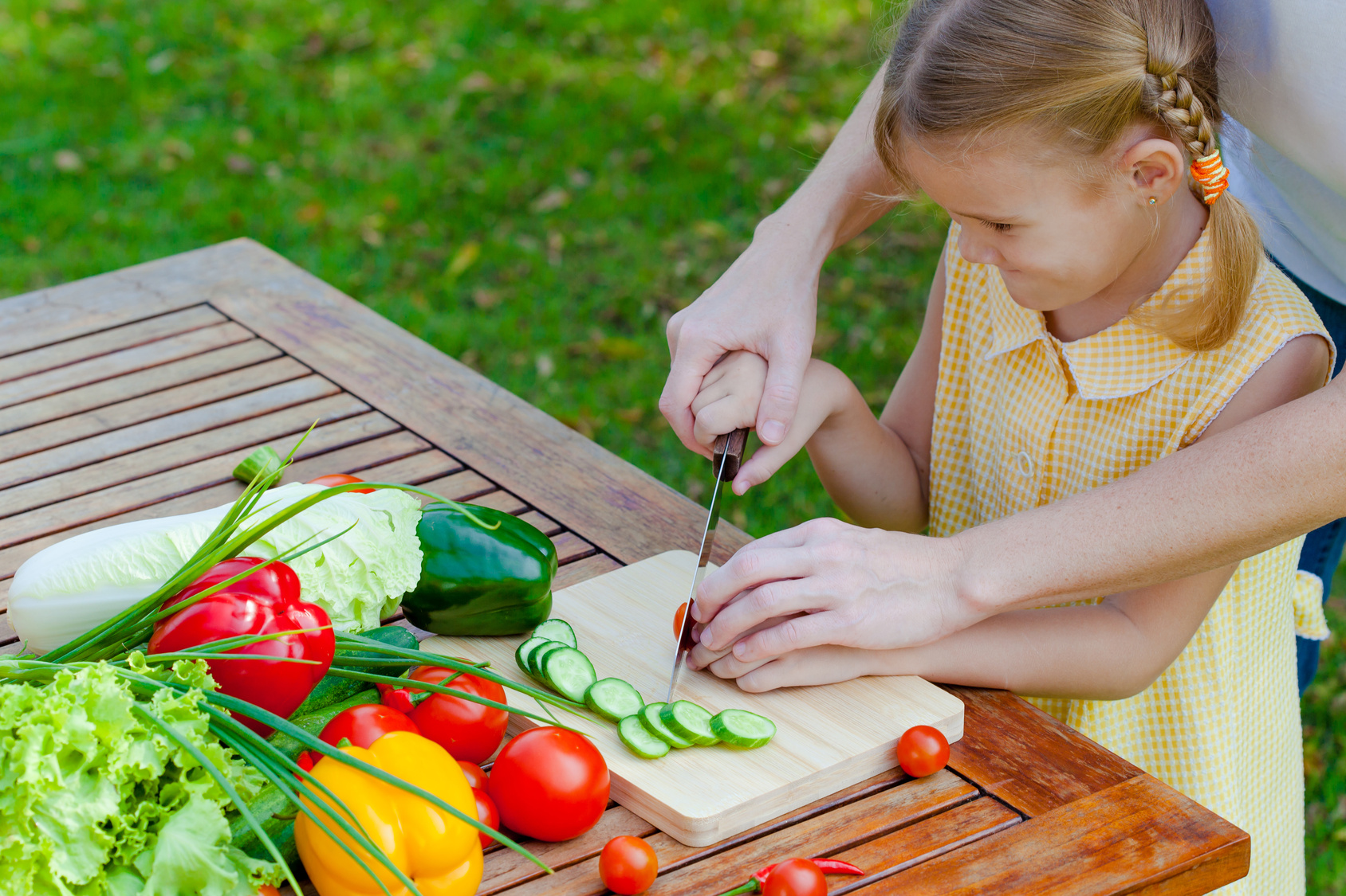 child chopping veggies
