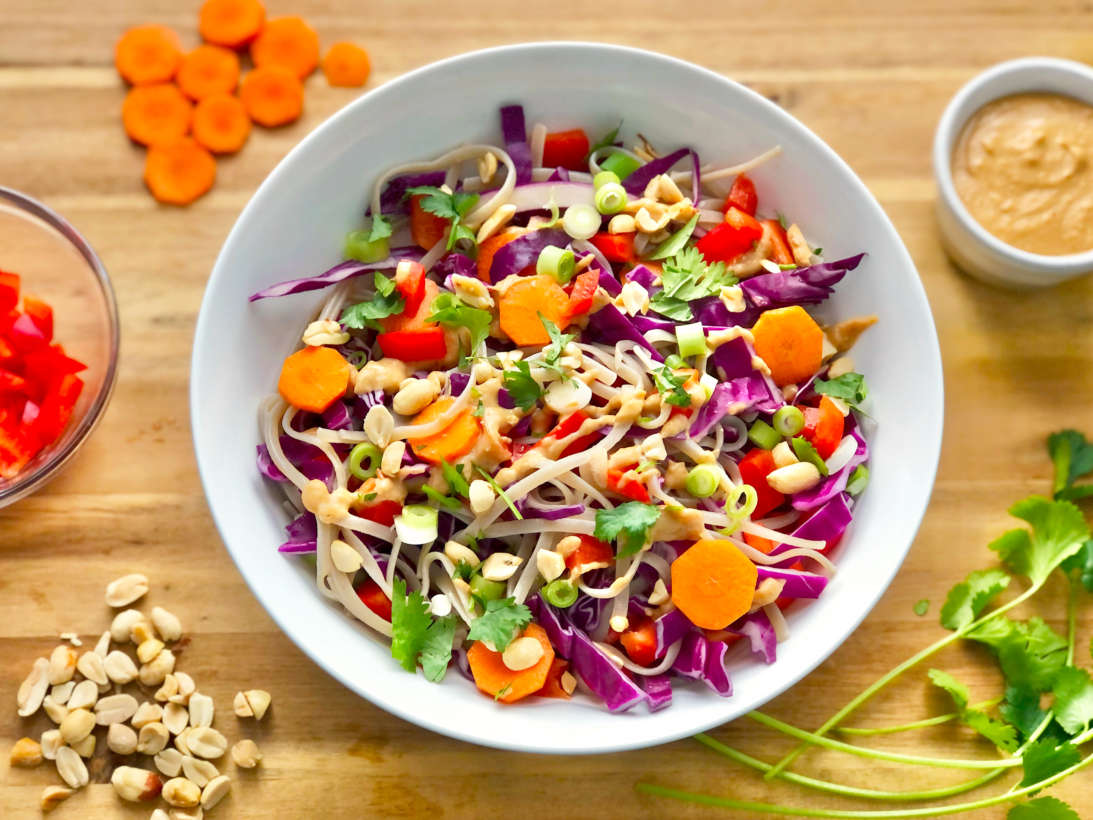 colorful salad with carrots, noodles, cabbage, and peanuts