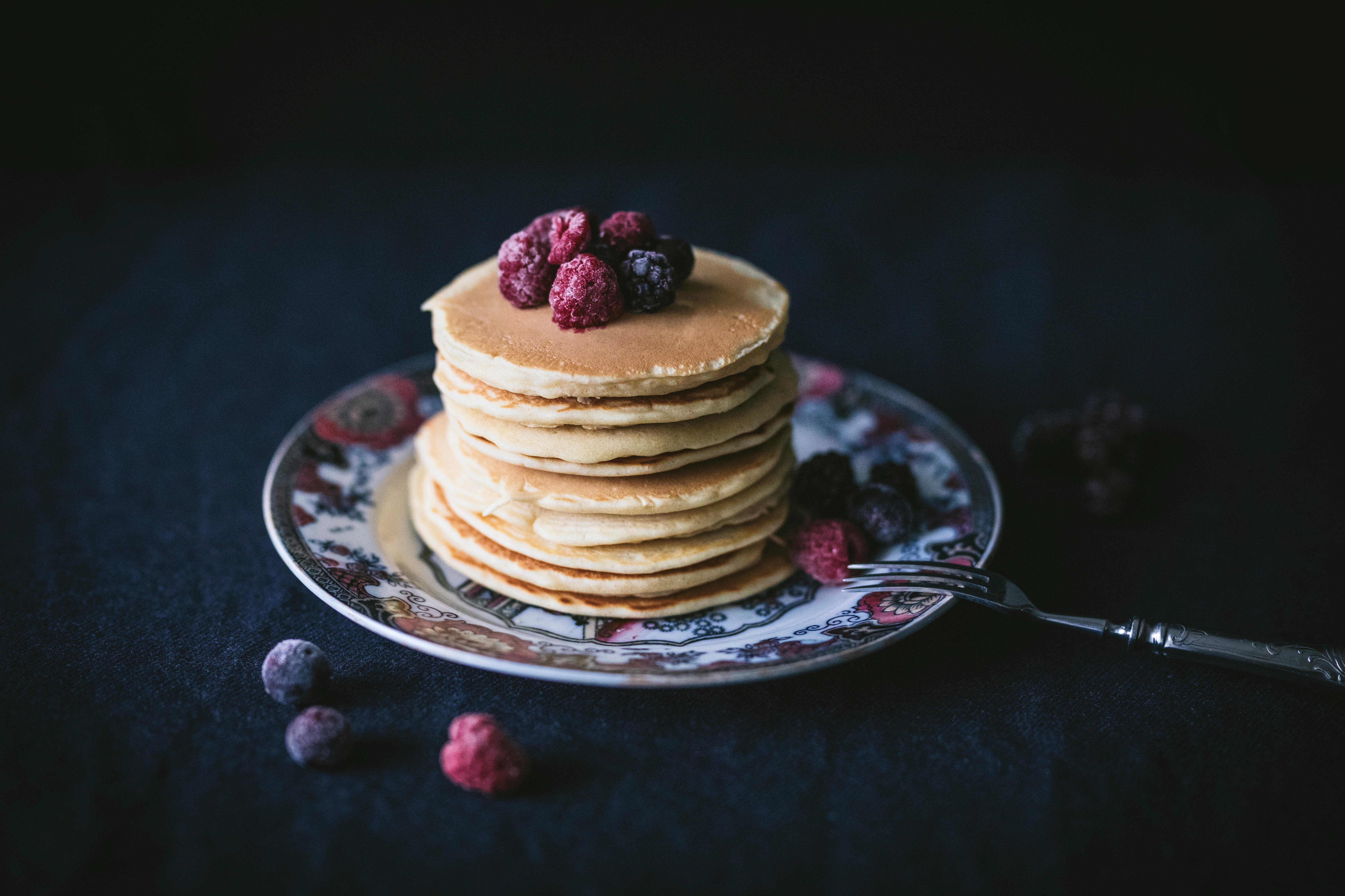 Stack of pancakes with fruit on top